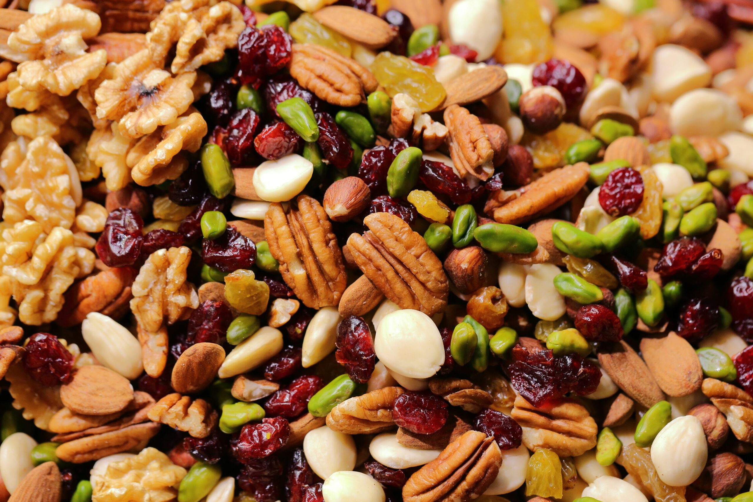 A picture of lots of mixed buts with dried cranberries.