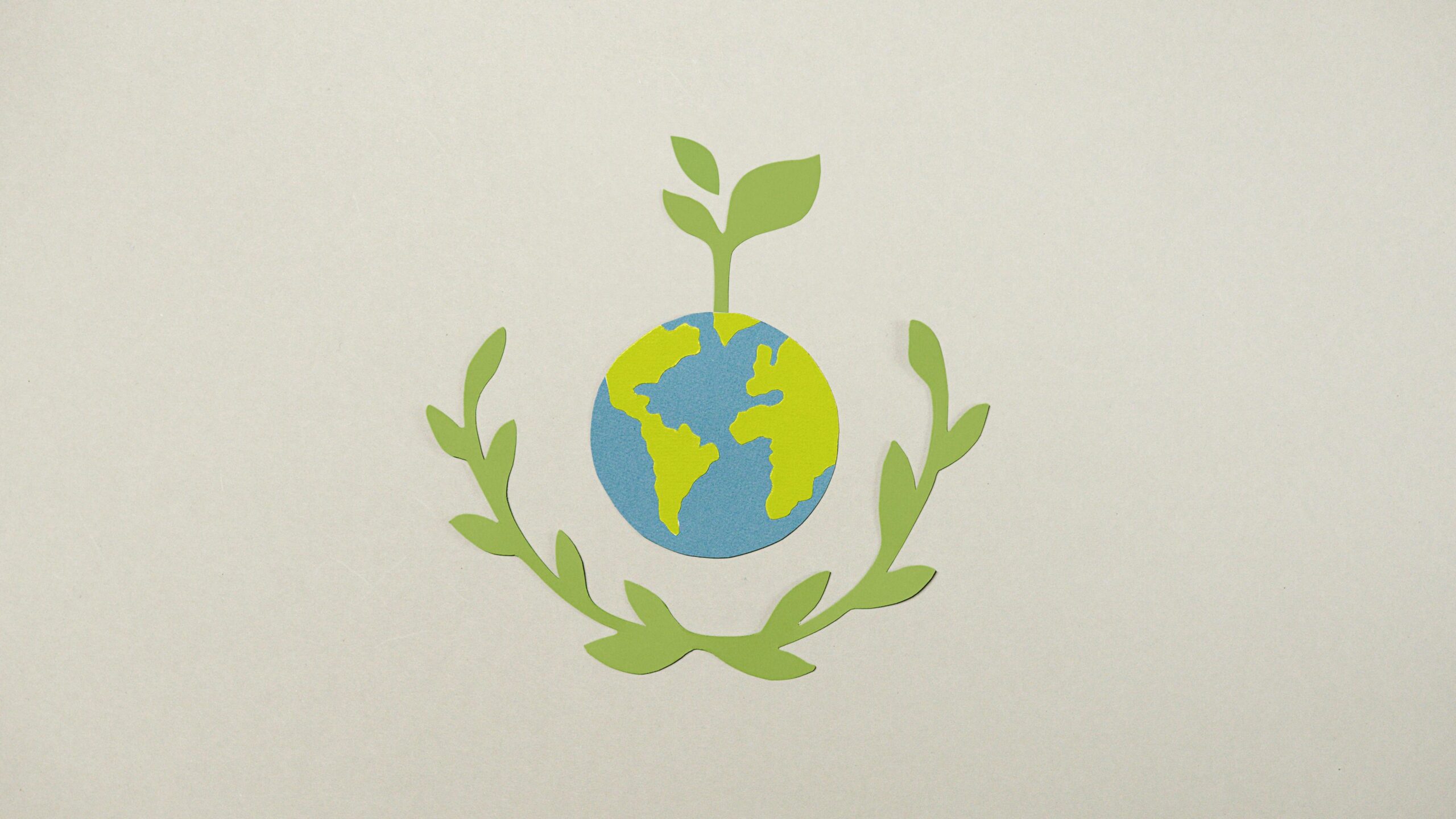 the earth with a vegan logo above